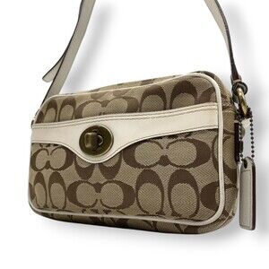Coach Women's Signature Canvas and Leather Shoulder Bag with Turnlock Closure...